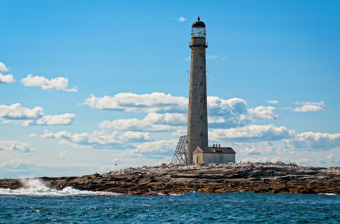 Lighthouse by the ocean on a sunny day Lighthouse by the ocean on a sunny day
