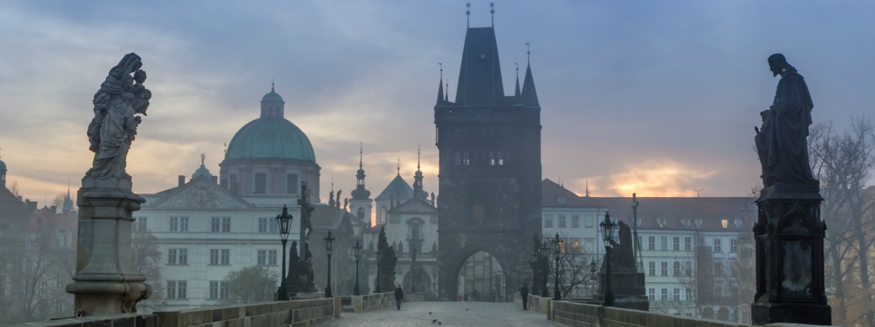 Charles Bridge, Prague, on a misty evening.