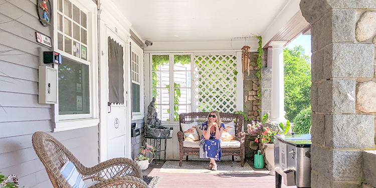 Lady in a wooden house balcony