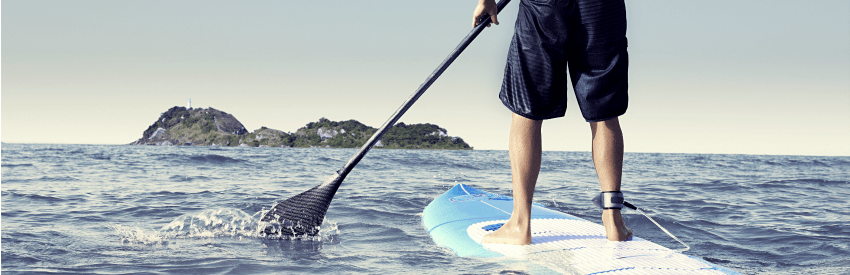 Close-up of a person paddle boarding