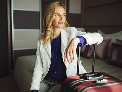 A woman and her suitcase