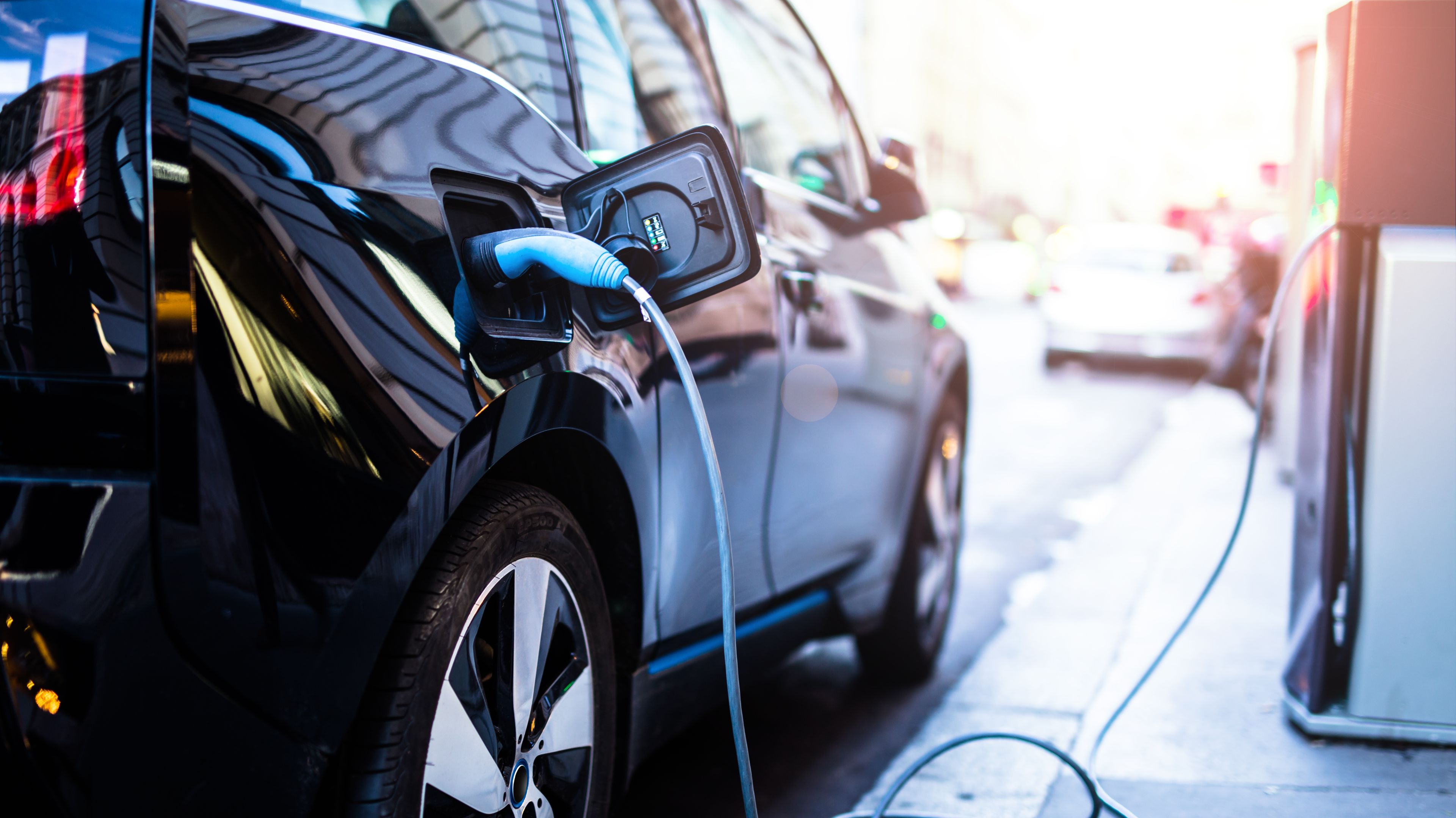 charging-modern-electric-car-on-street charging-modern-electric-car-on-street