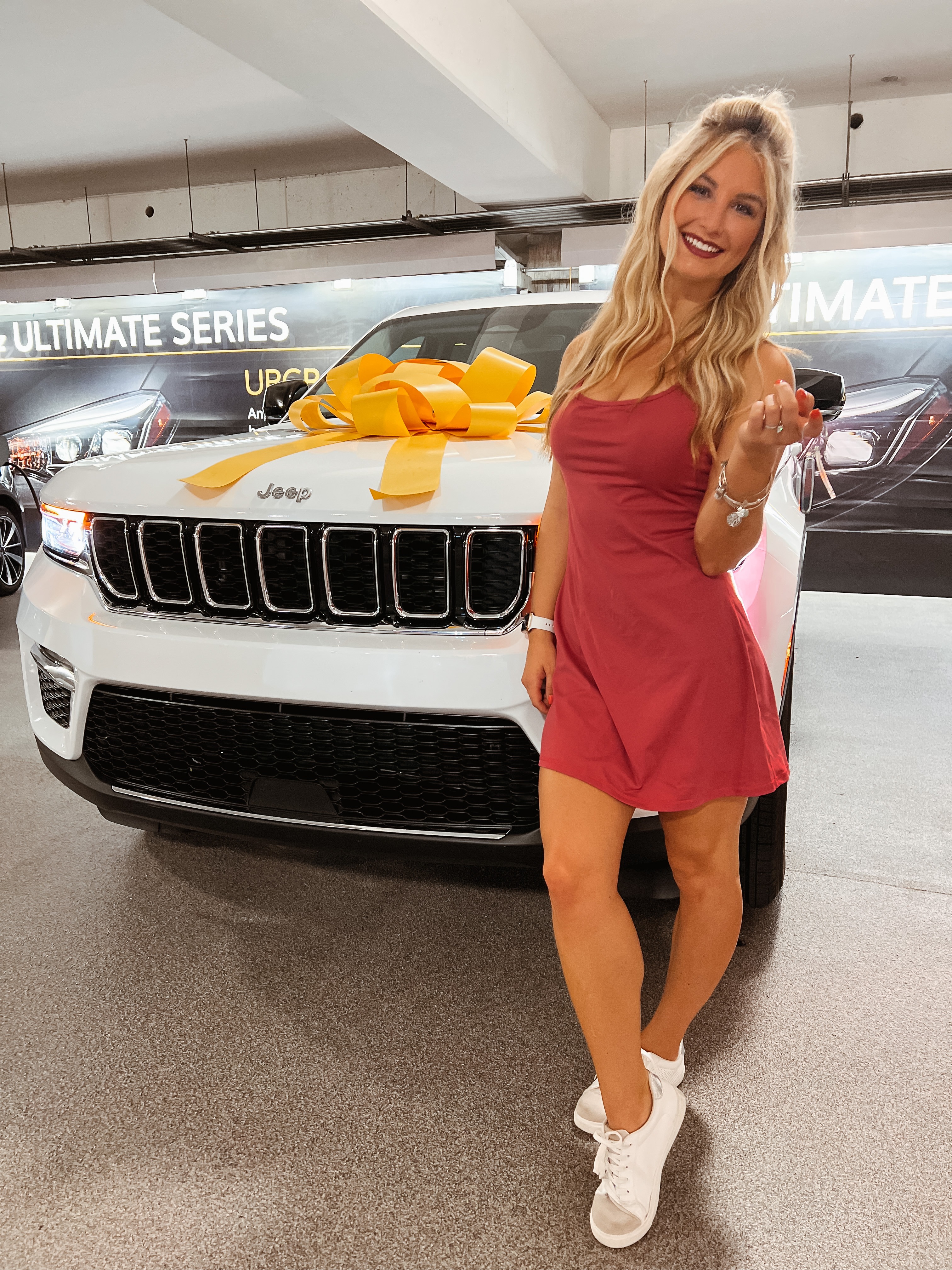 Amber Miller with white Jeep in Hertz car rental lot Amber Miller with white Jeep in Hertz car rental lot