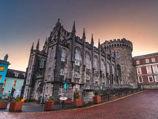 ALT= An impressive view of the medieval Dublin Castle in the Old City of Dublin, Ireland at dusk.