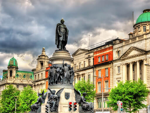 Monument of Daniel O'Connell is seen on a cloudy afternoon on O’Connell Street in Dublin, Ireland. Monument of Daniel O'Connell is seen on a cloudy afternoon on O’Connell Street in Dublin, Ireland.