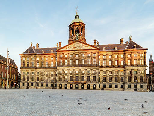 Amsterdam’s central space, Dam Square, and the regal Royal Palace