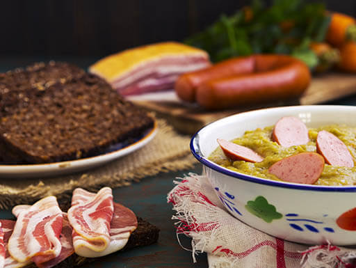 Traditional Dutch pea soup with sausage and rye bread