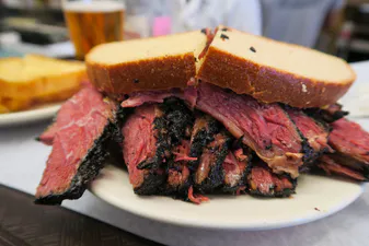 Pastrami/Smoked meat sandwich on a plate from the famous Katz Deli in New York Katz’s Deli