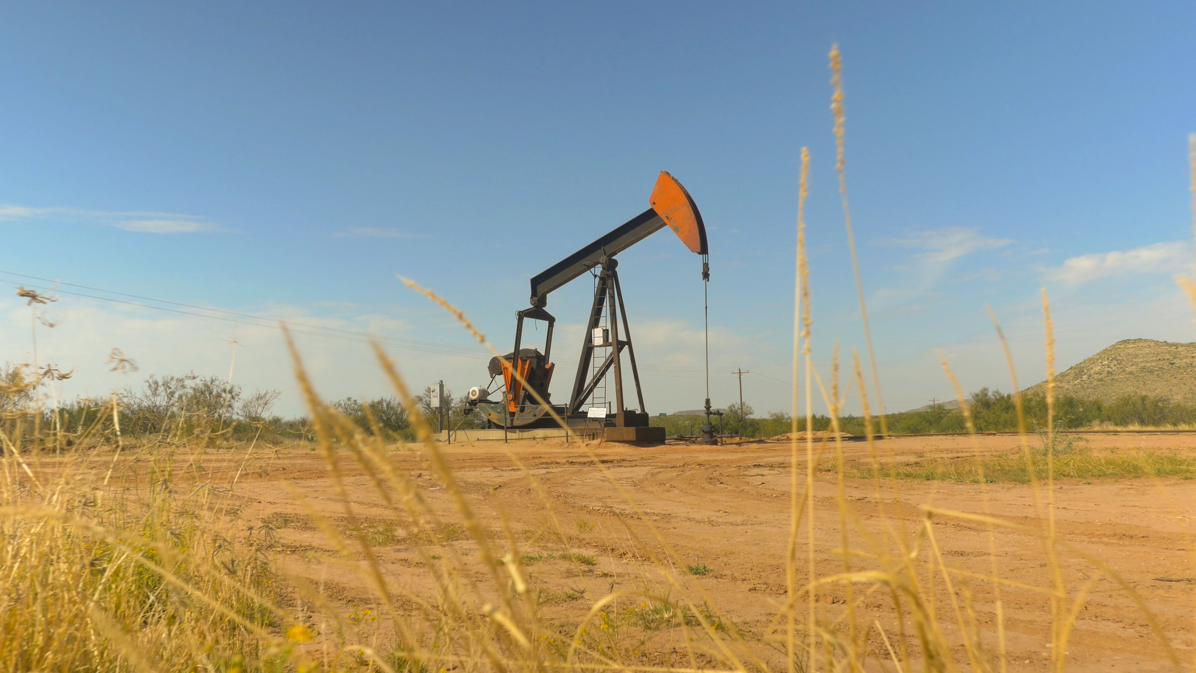 Industrial jack pump platform working on oil field in Texas Industrial jack pump platform working on oil field in Texas