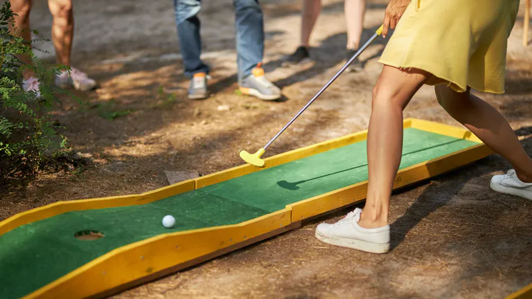 People playing minigolf