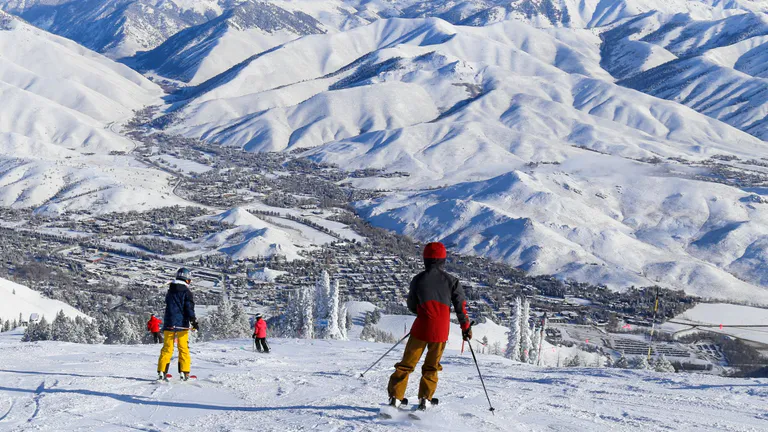 People skiing on snowy mountain