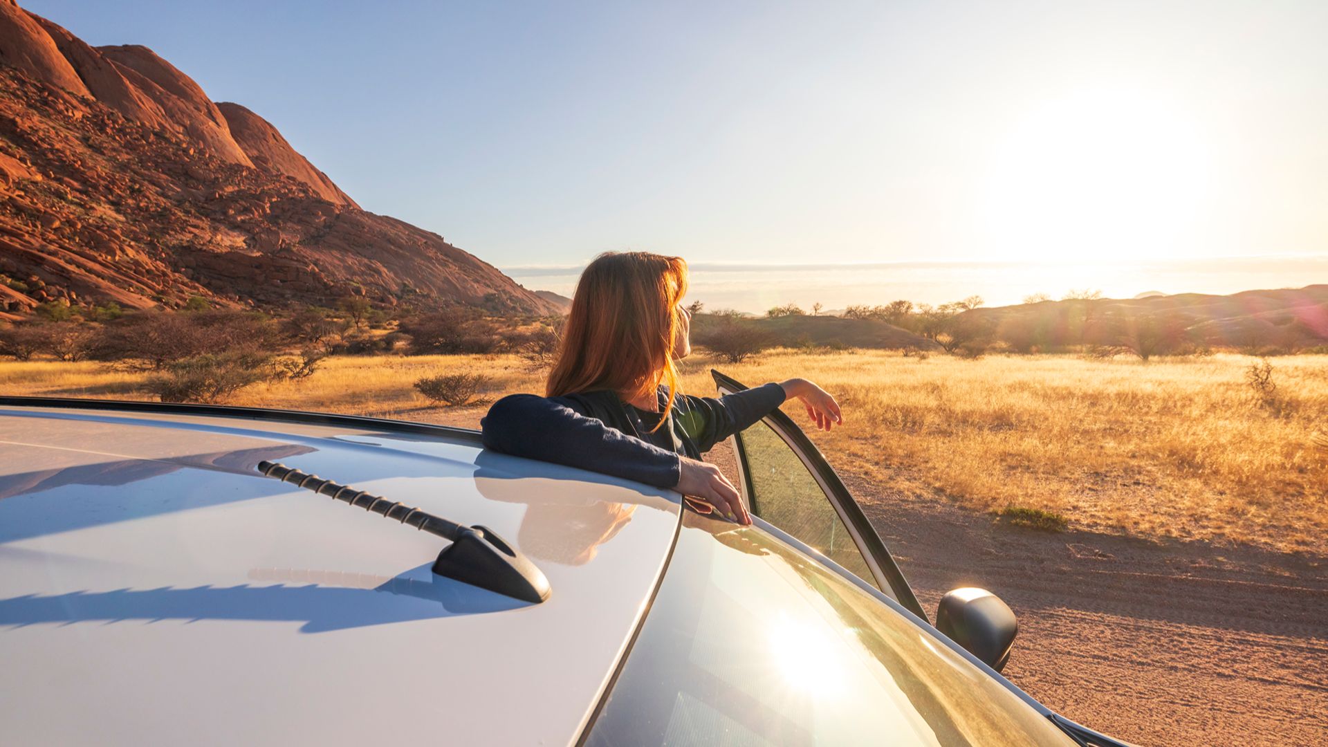 a woman sitting in the back of a car a woman sitting in the back of a car
