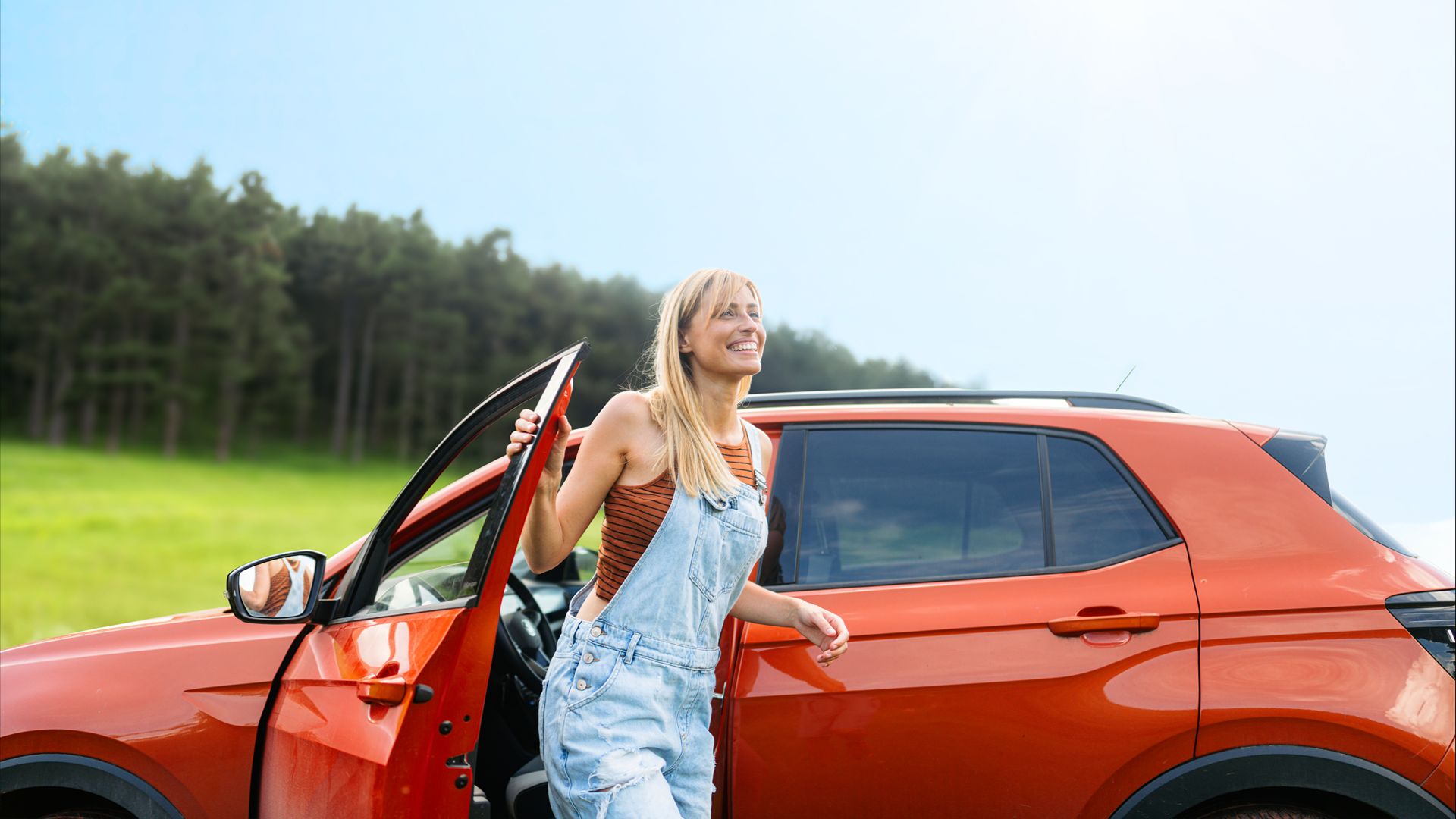 woman outside a rental car